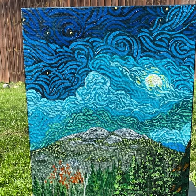 Painting of a swirling blue night sky with a full moon over mountains and a wildflower meadow